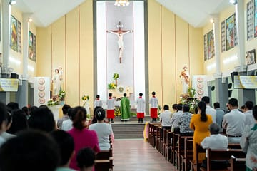 A church service with a congregation and clergy, highlighting religious tradition.